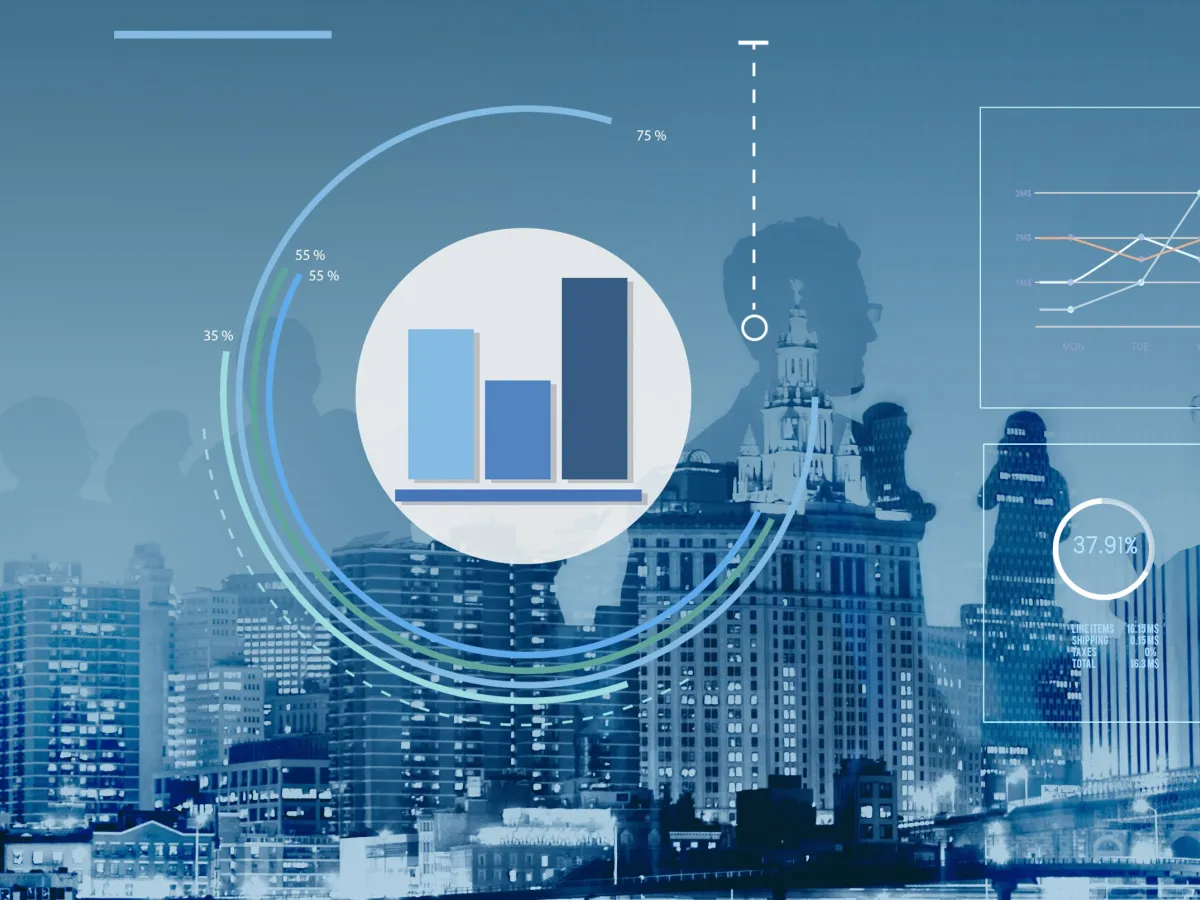 háttérben felhőkarcolók, a kép előterében adatelemzés grafikonjai láthatók